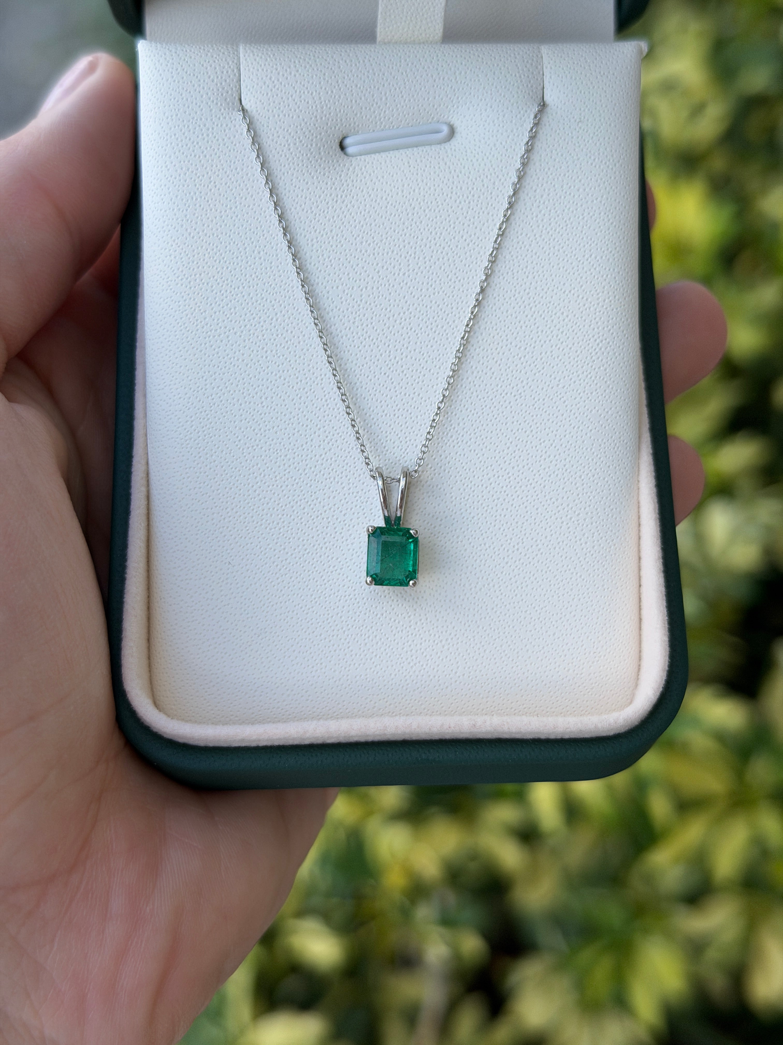 Platinum solitaire necklace featuring a 2.10ct rich green Asscher cut emerald by JR Colombian Emeralds.