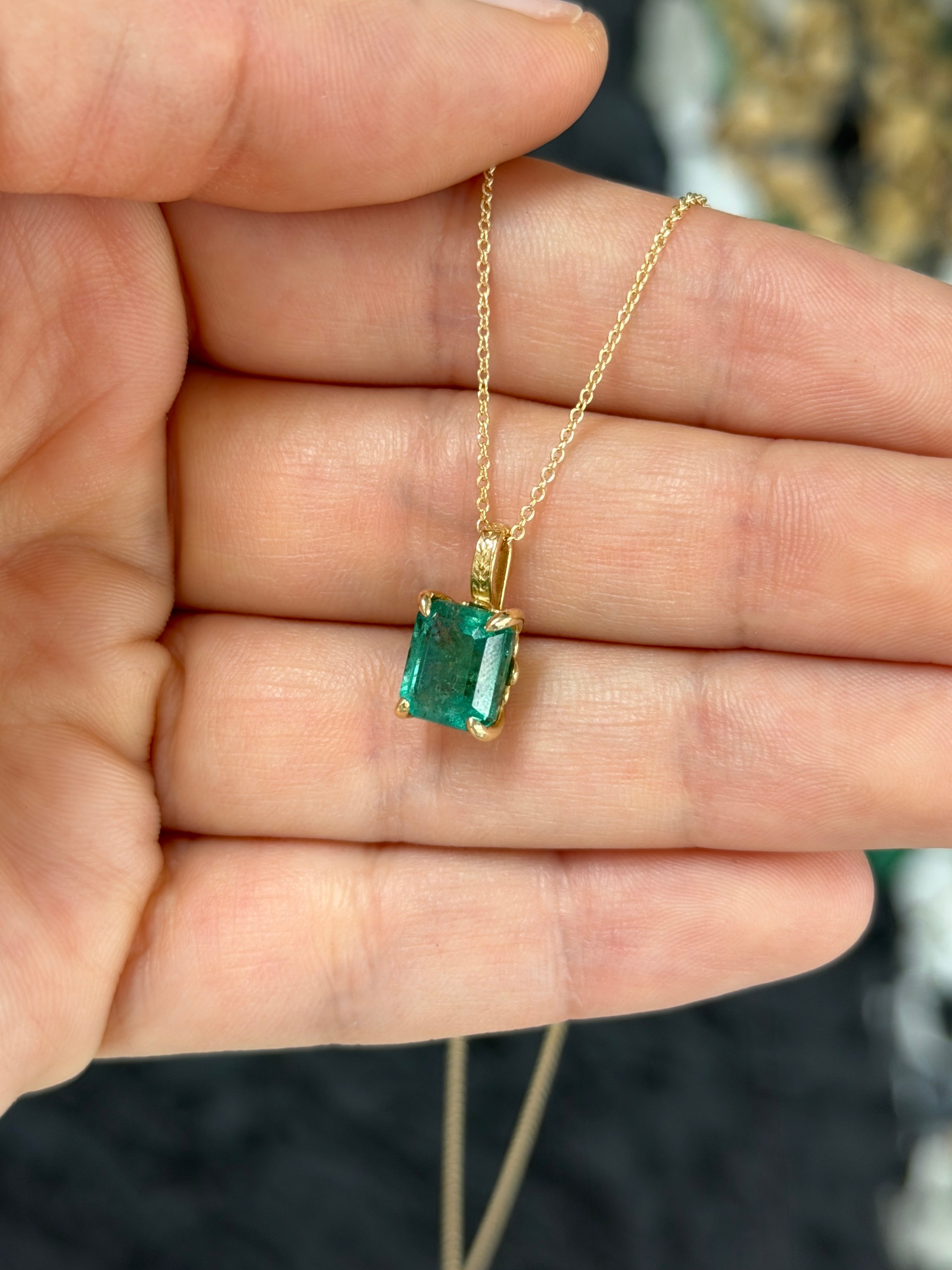 14K gold emerald necklace with 3.50 carat solitaire Fleur De Lis design from JR Colombian Emeralds, featuring a central emerald gemstone.