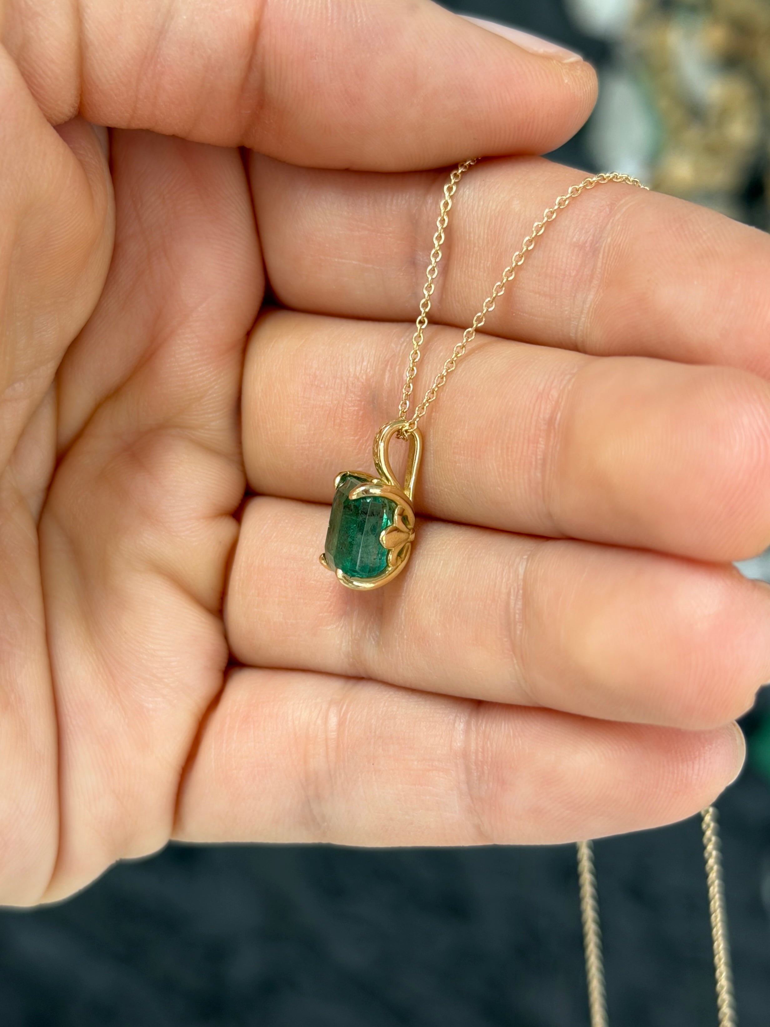 14K gold solitaire fleur de lis emerald necklace featuring a 3.50 carat center gemstone, elegant and detailed jewelry piece.