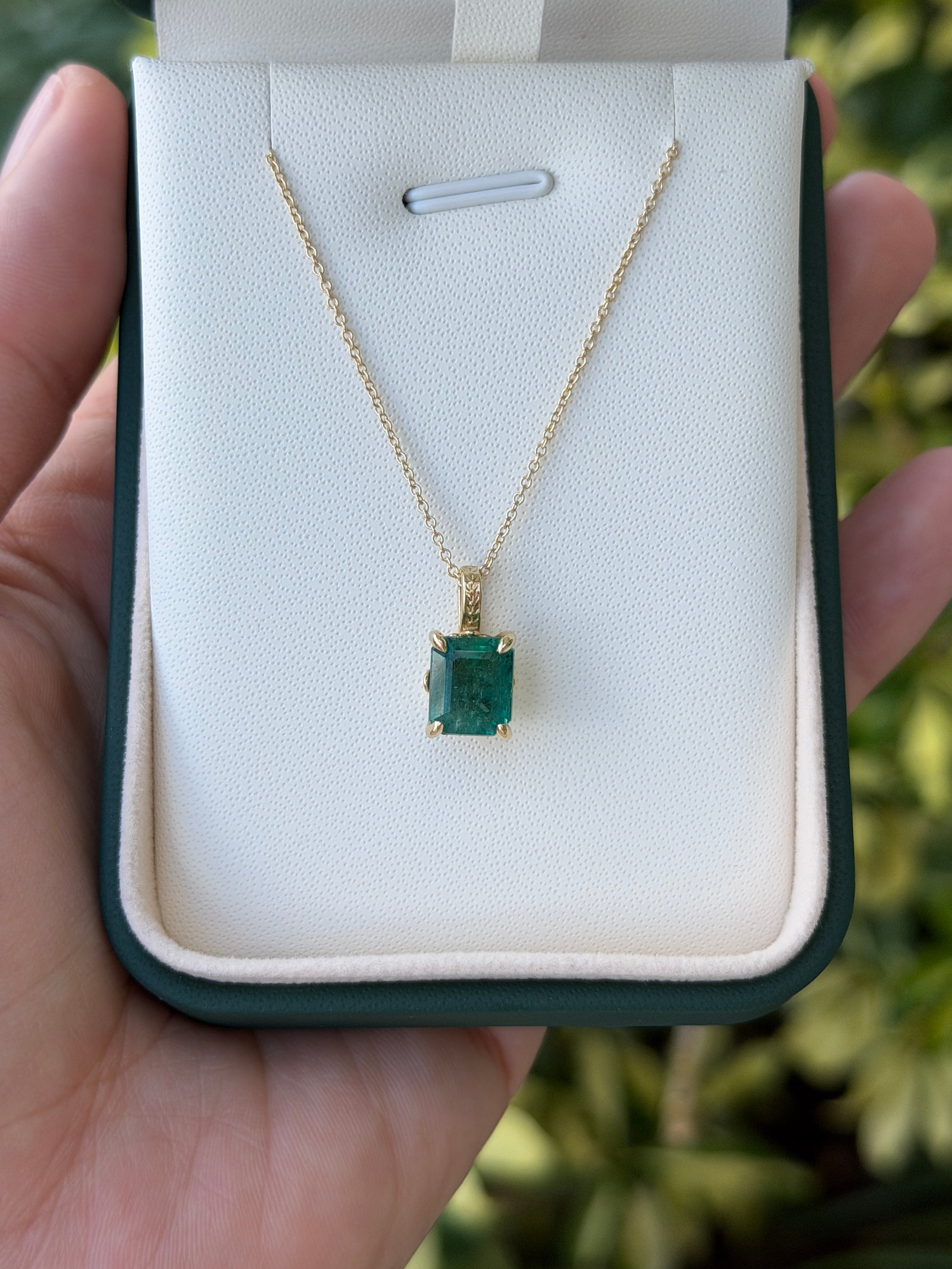 14K gold emerald necklace featuring a 3.50 carat solitaire Fleur De Lis design by JR Colombian Emeralds.