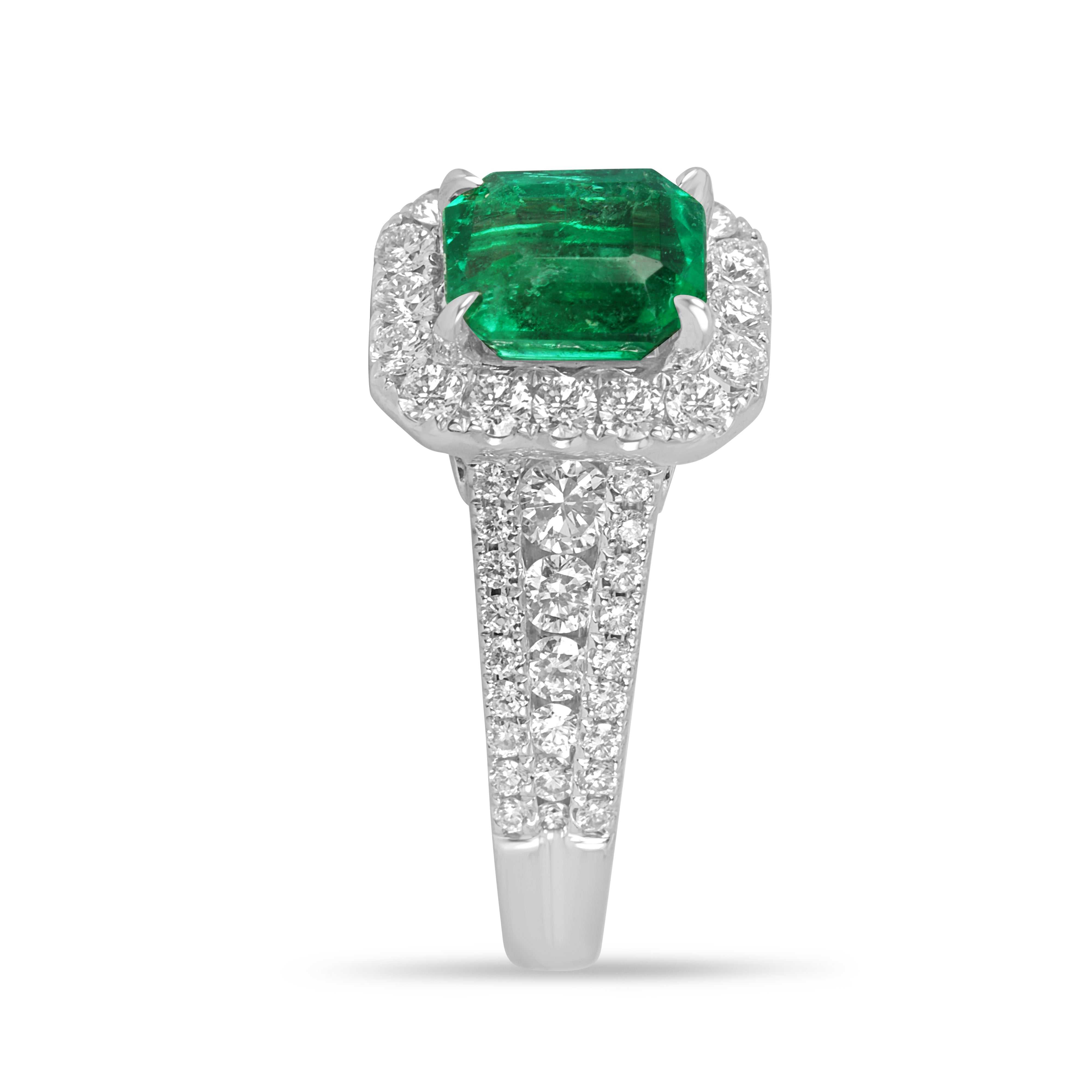 14K engagement ring with 2.21tcw Chivor bluish green Colombian emerald and diamond halo, featuring a detailed band and elegant design.