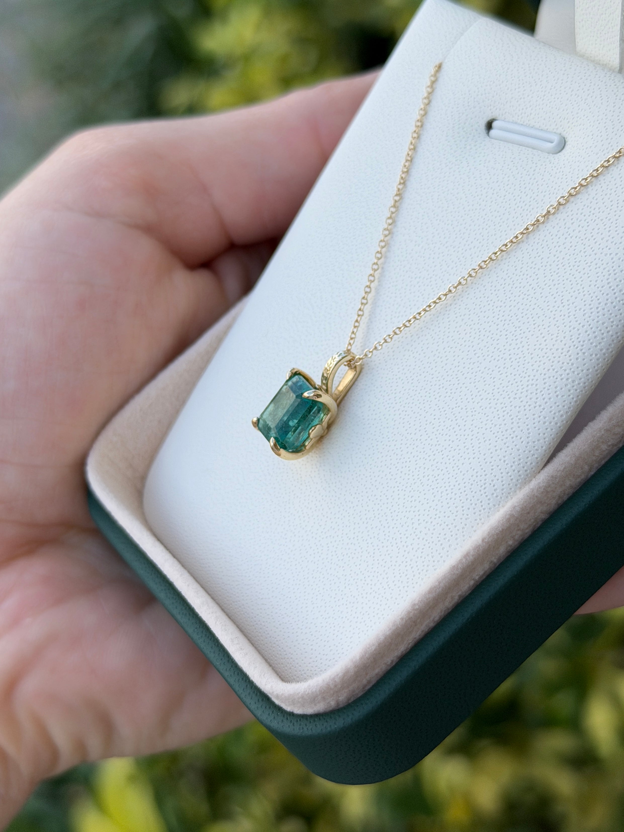 14K emerald necklace featuring a 3.50 carat solitaire fleur de lis pendant by JR Colombian Emeralds.