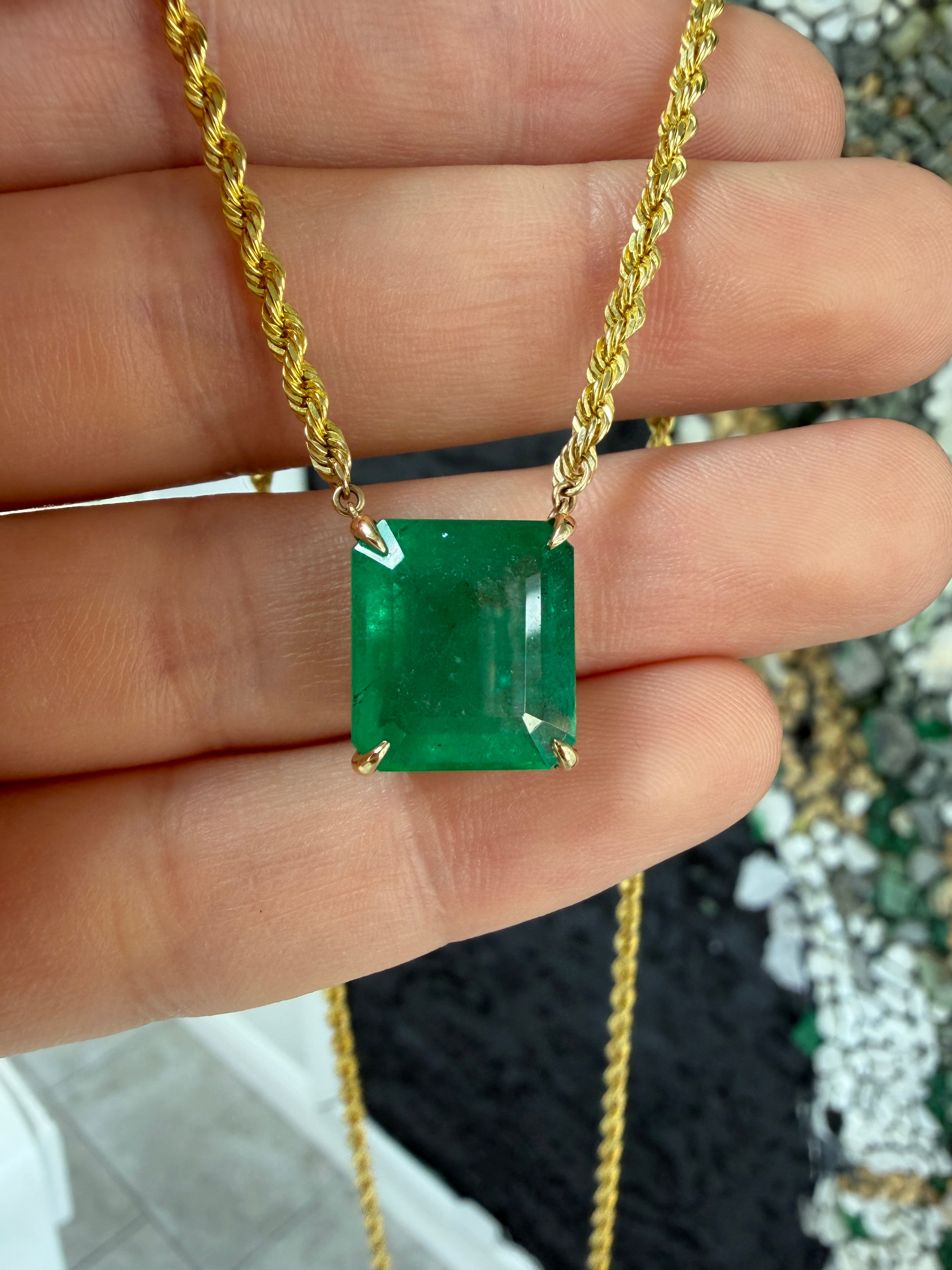 14K emerald cut emerald solitaire necklace with 10.38 carats on a 20-inch rope chain, by JR Colombian Emeralds.