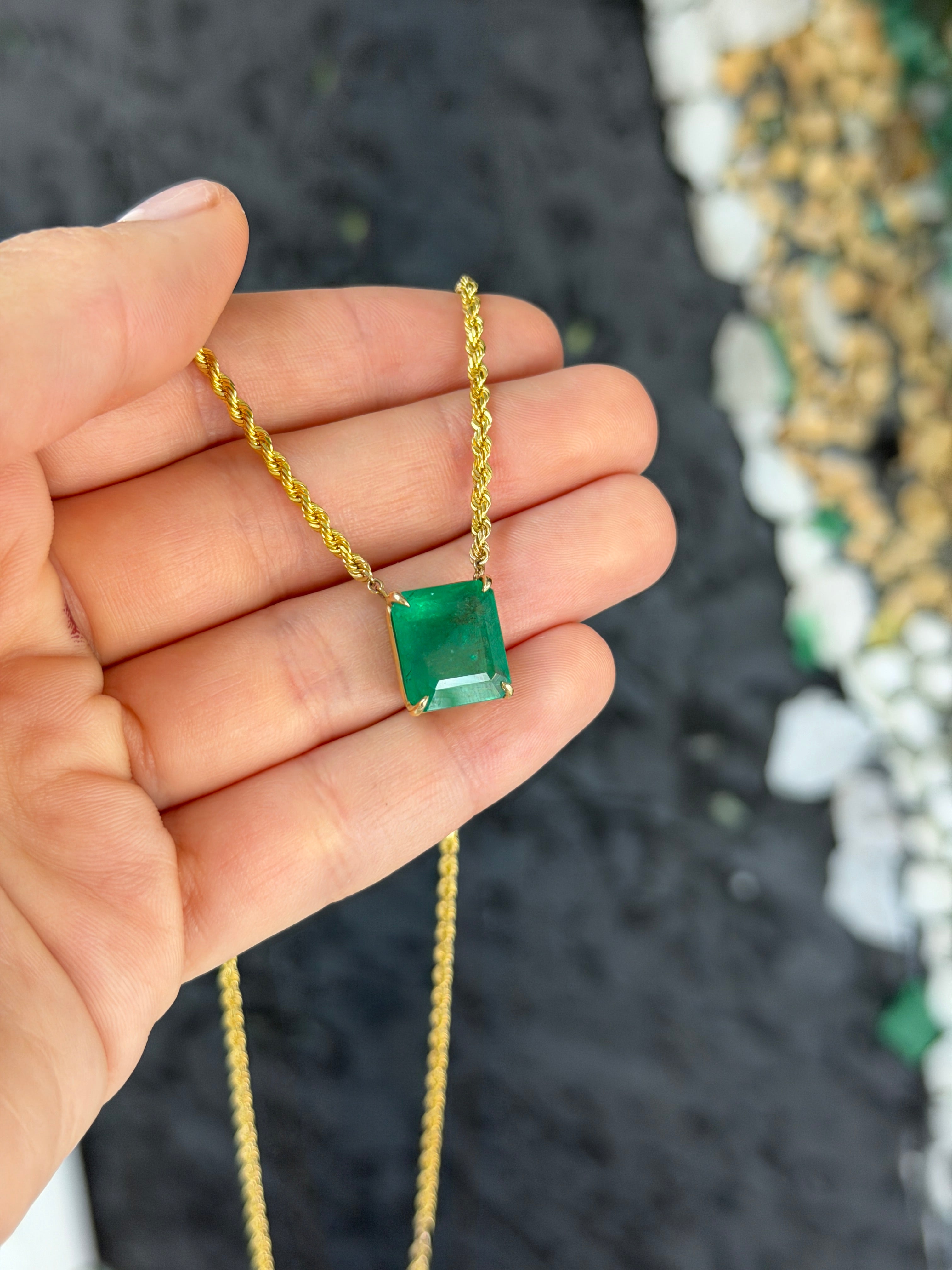 14K emerald cut emerald solitaire necklace with 20-inch rope chain, featuring a striking gemstone from JR Colombian Emeralds.