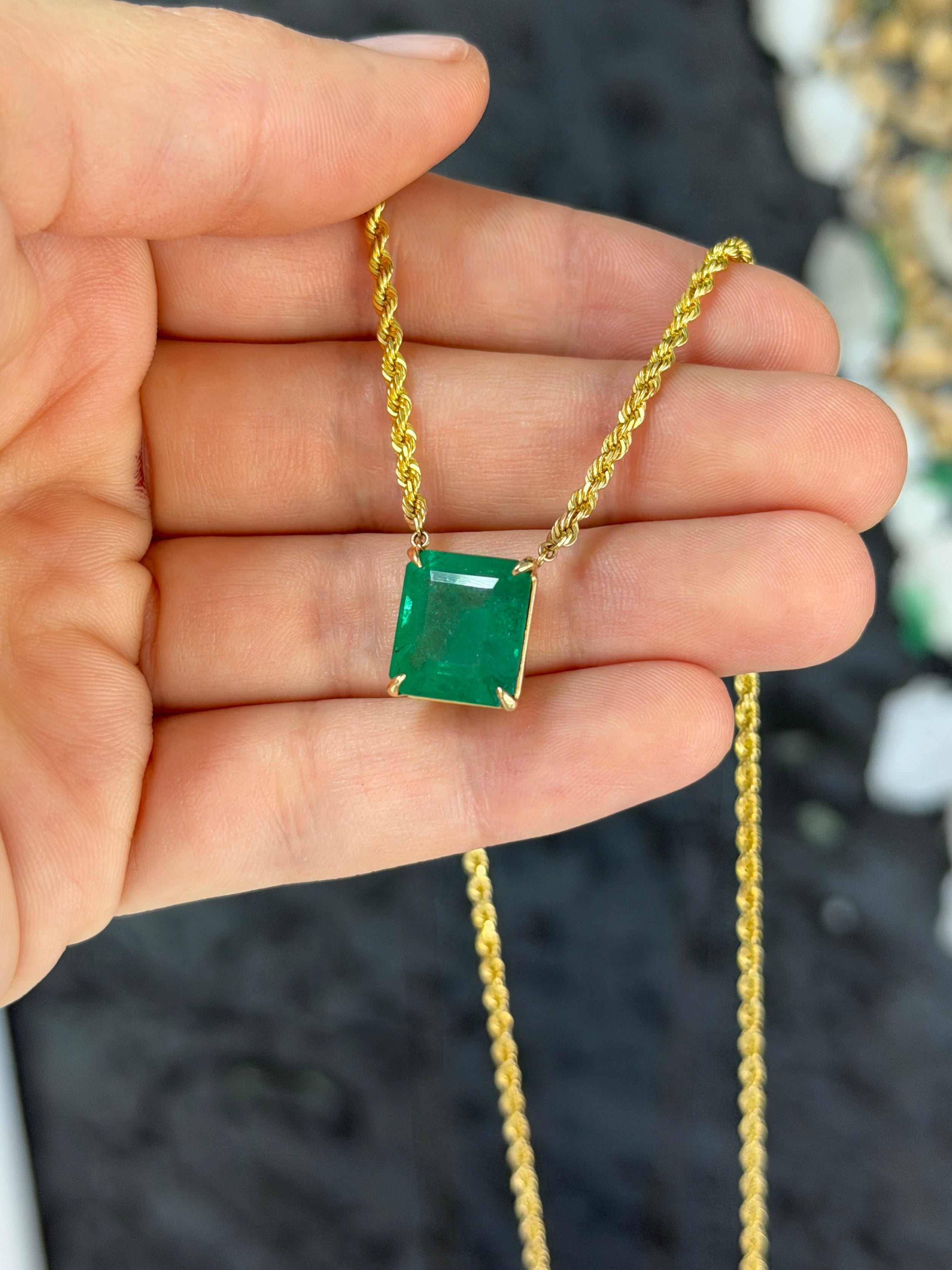 14K emerald cut emerald solitaire necklace with 10.38ct gemstone on a 20-inch rope chain by JR Colombian Emeralds.