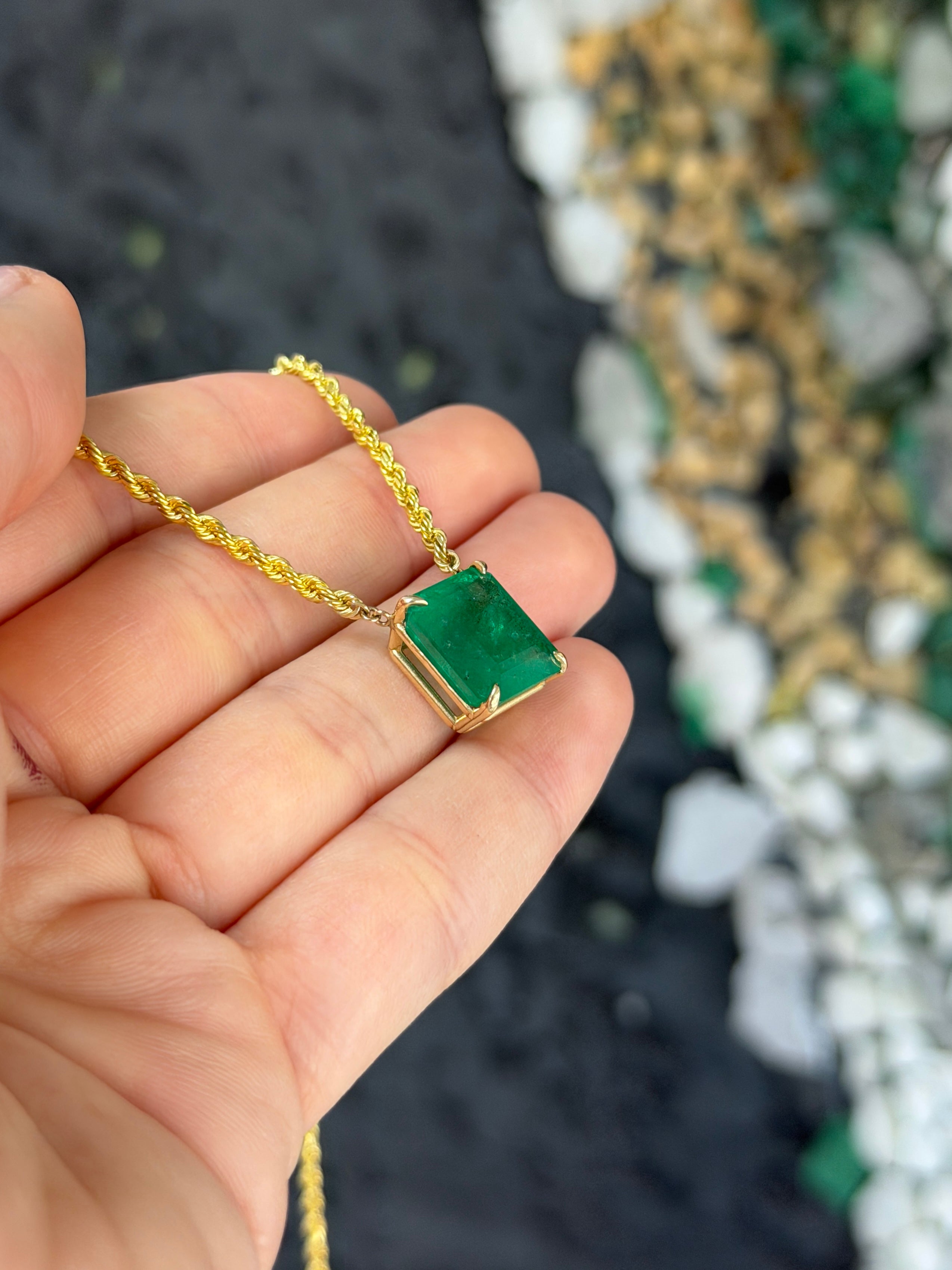 14K emerald cut emerald solitaire necklace with 10.38ct gemstone on a 20-inch rope chain, jewelry by JR Colombian Emeralds.