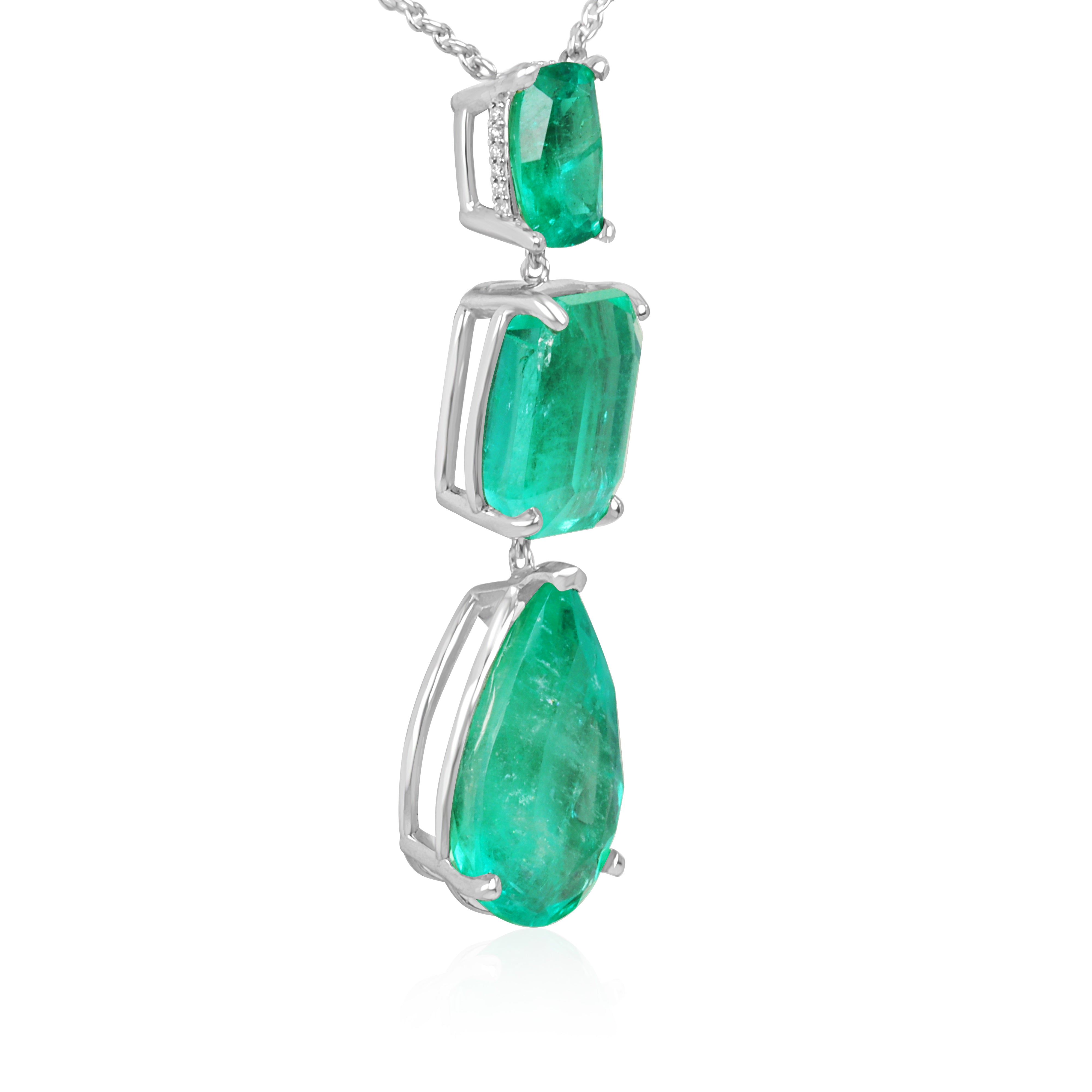 Colombian emerald and diamond by the yard necklace featuring cushion and pear-cut emeralds with platinum setting.
