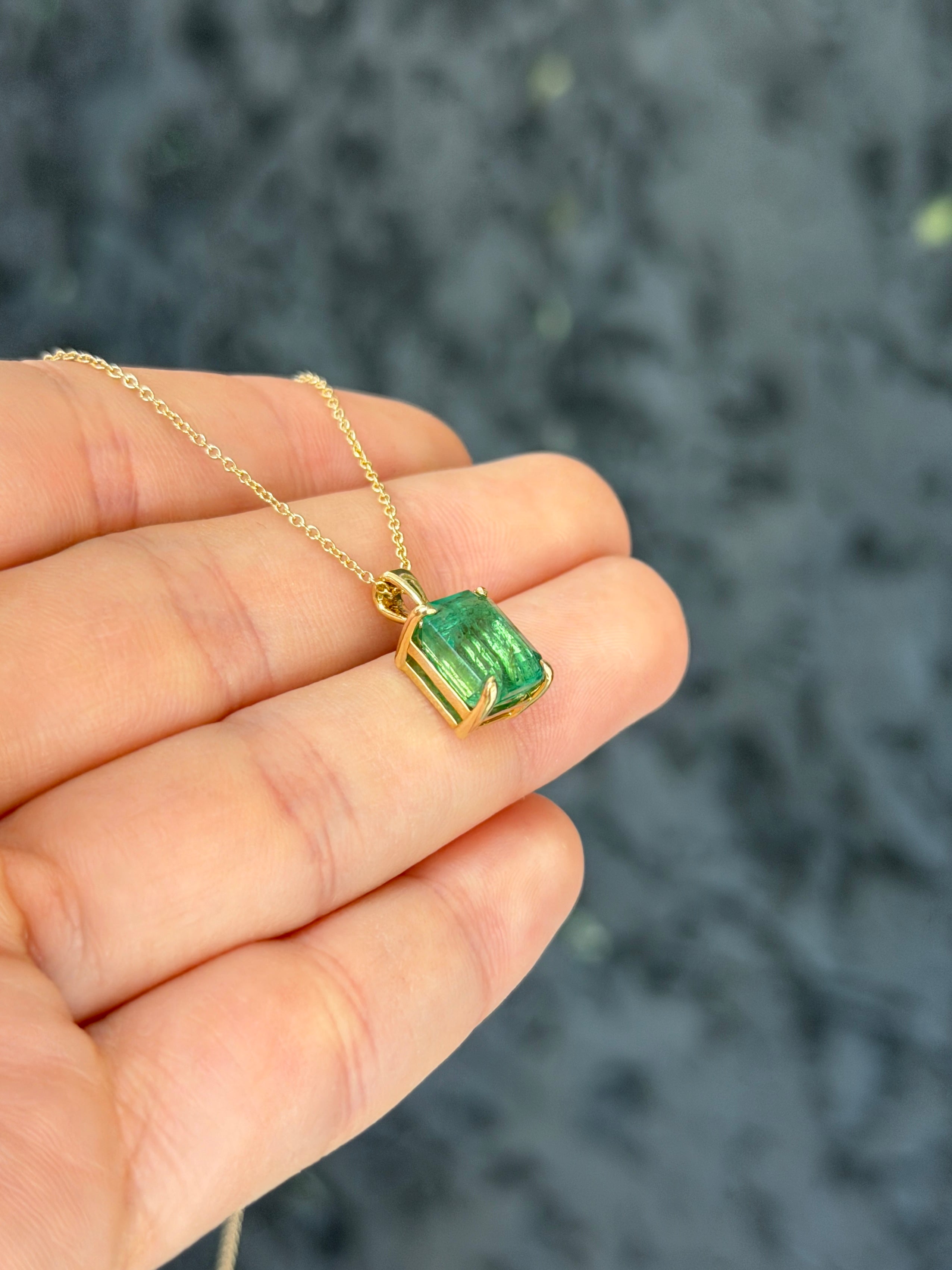 14K gold emerald solitaire necklace featuring a 4.25ct earthy natural emerald pendant, crafted by JR Colombian Emeralds.