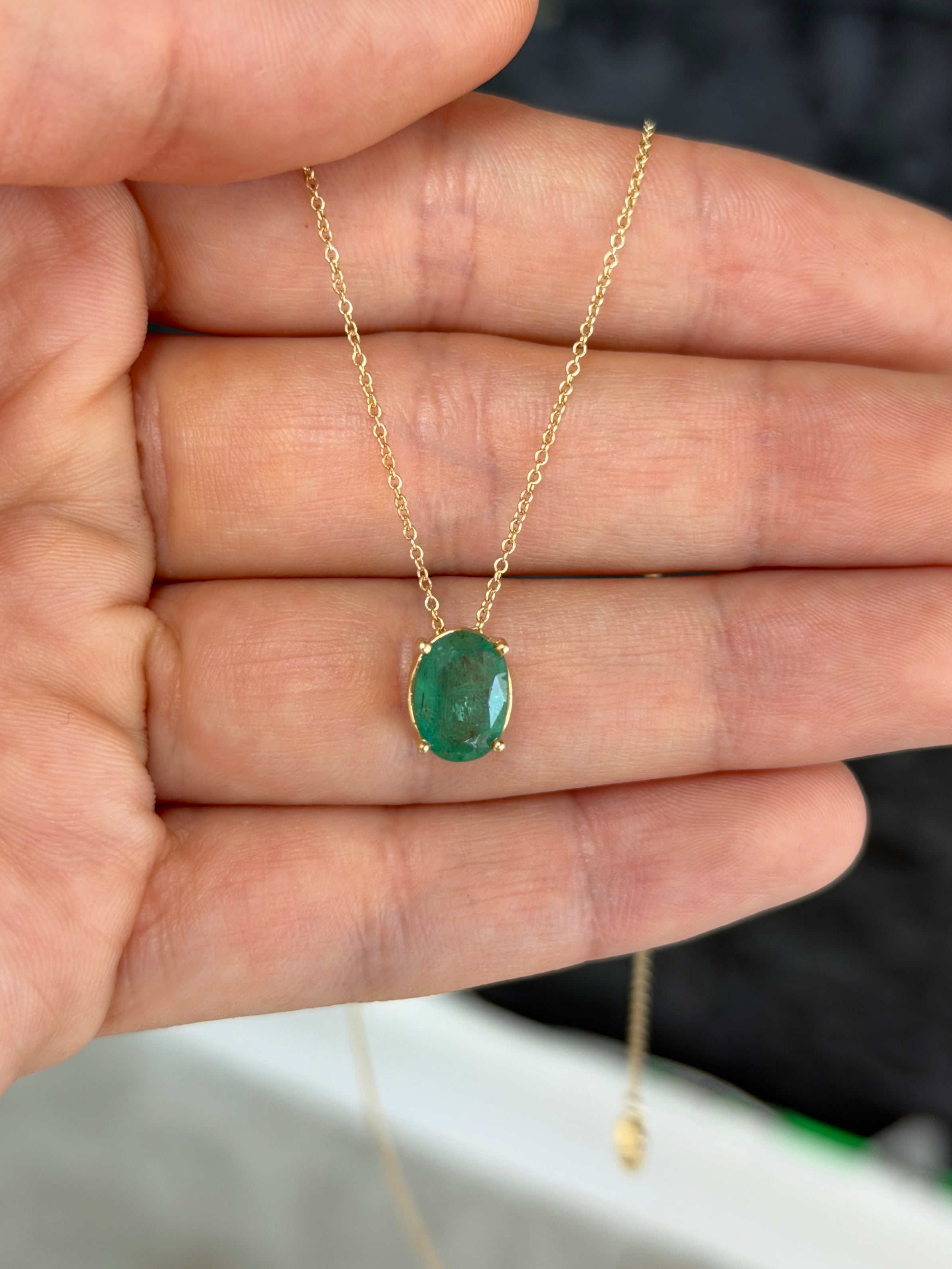 2.15 carat emerald oval solitaire pendant necklace in 14K gold, featuring a convertible slider design by JR Colombian Emeralds.