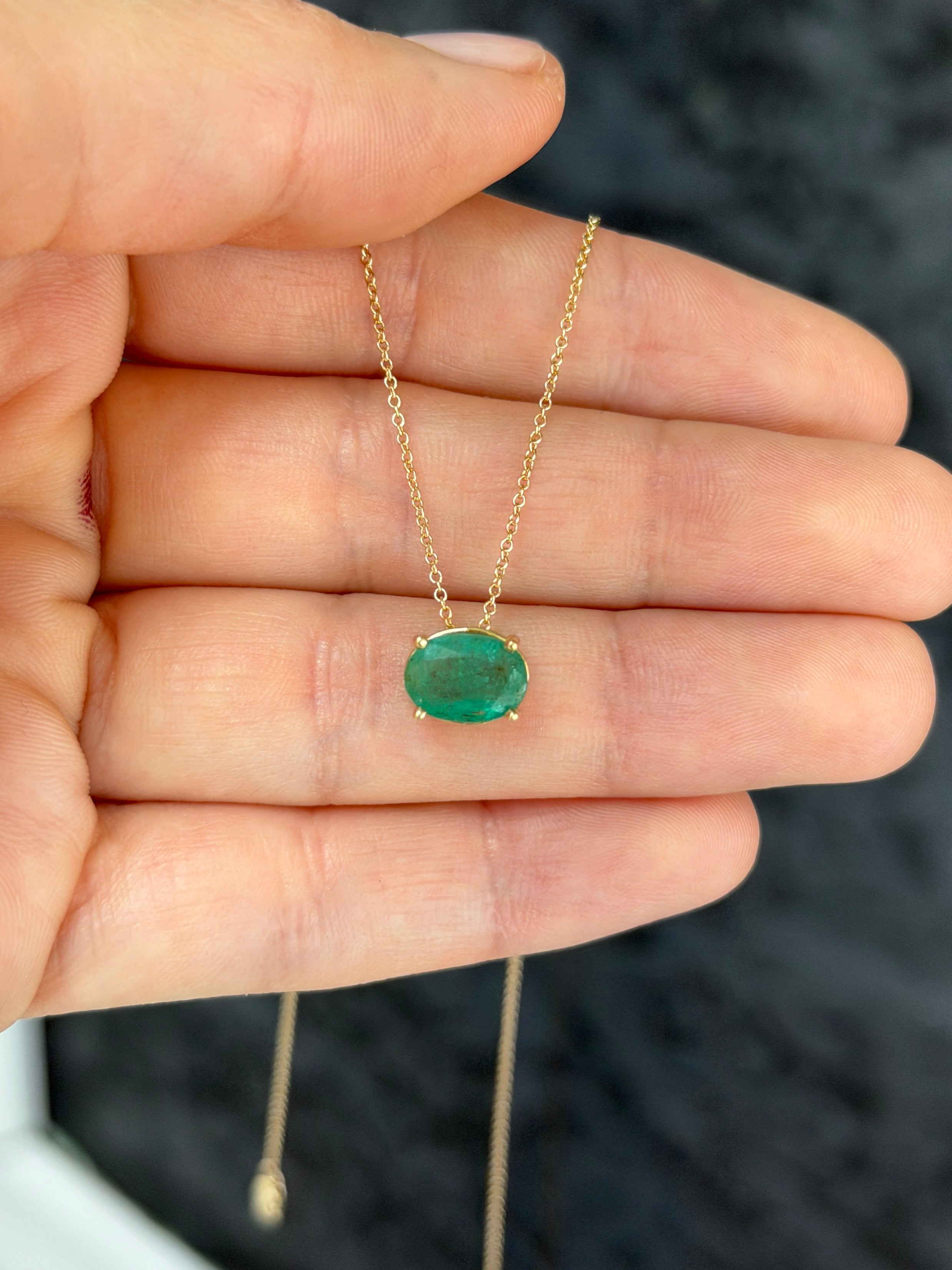 14K gold solitaire emerald oval slider necklace with 2.15 carat emerald center stone from JR Colombian Emeralds.