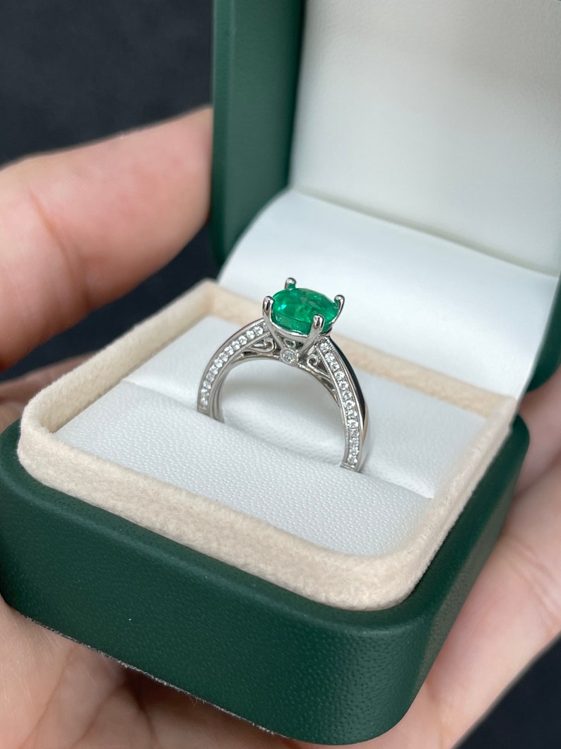 Colombian Emerald engagement ring with 2.44tcw cushion-cut emerald, diamonds accents, set in 18K white gold.