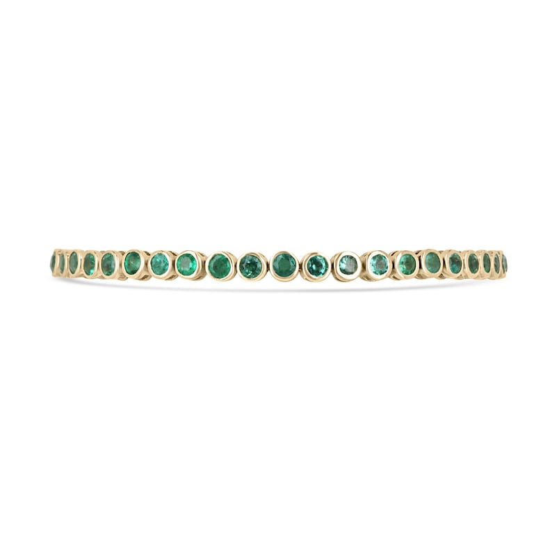 Unisex emerald bezel tennis bracelet with medium green round-cut Colombian emeralds in 14K yellow gold, 9.40tcw.