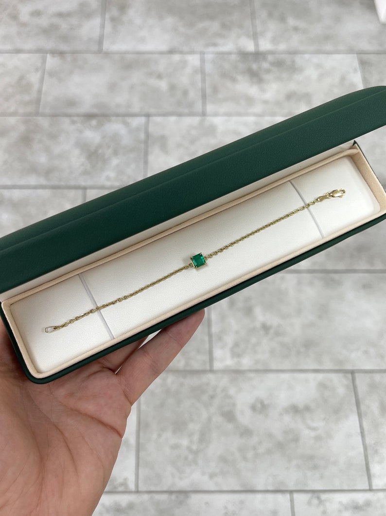 14K gold bracelet with a 1.70ct dark green emerald Asscher cut diamond chain from Colombian Emerald, featuring four prong settings.
