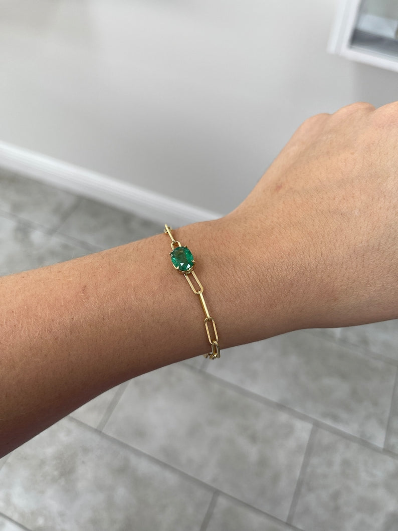 Colombian Emerald 2.65ct oval cut solitaire paperclip bracelet with dark green emerald, 14K gold, and 4-prong east-west setting