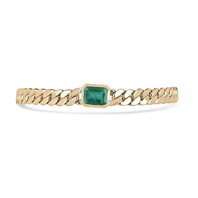 2.80 carat emerald cut bezel-set emerald on 14K yellow gold men’s Cuban link bracelet