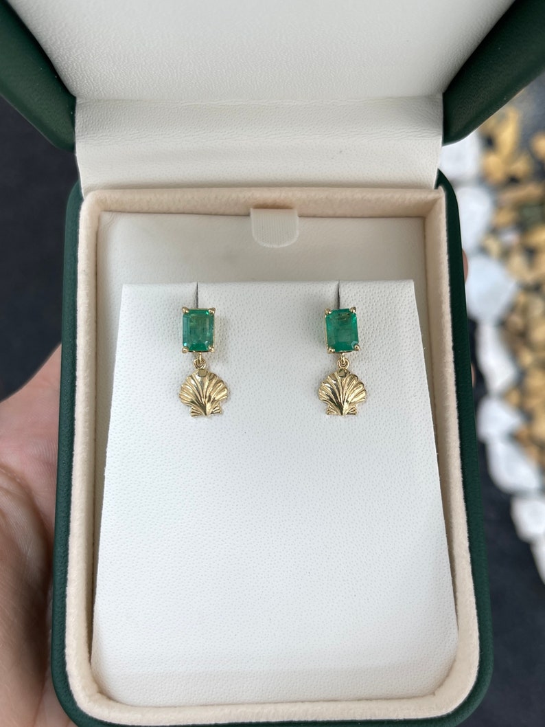 14K gold emerald and ocean sea shell dangle stud earrings with 1.90tcw from Colombian Emerald, showcasing intricate design and craftsmanship.