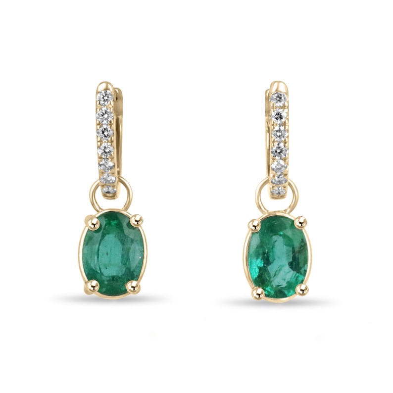 Lush green oval cut emerald dangle earrings with diamond accents in 14K gold, Colombian Emerald brand.