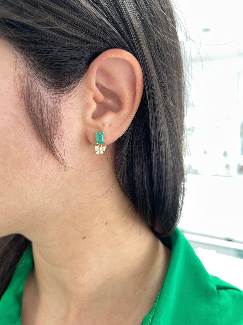 14K gold natural emerald and diamond butterfly dangle earrings, featuring 2.40tcw in a Colombian Emerald design.