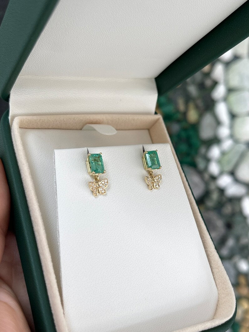 14K gold butterfly dangle earrings with natural emeralds and diamonds, featuring a 2.40tcw weight from Colombian Emerald.