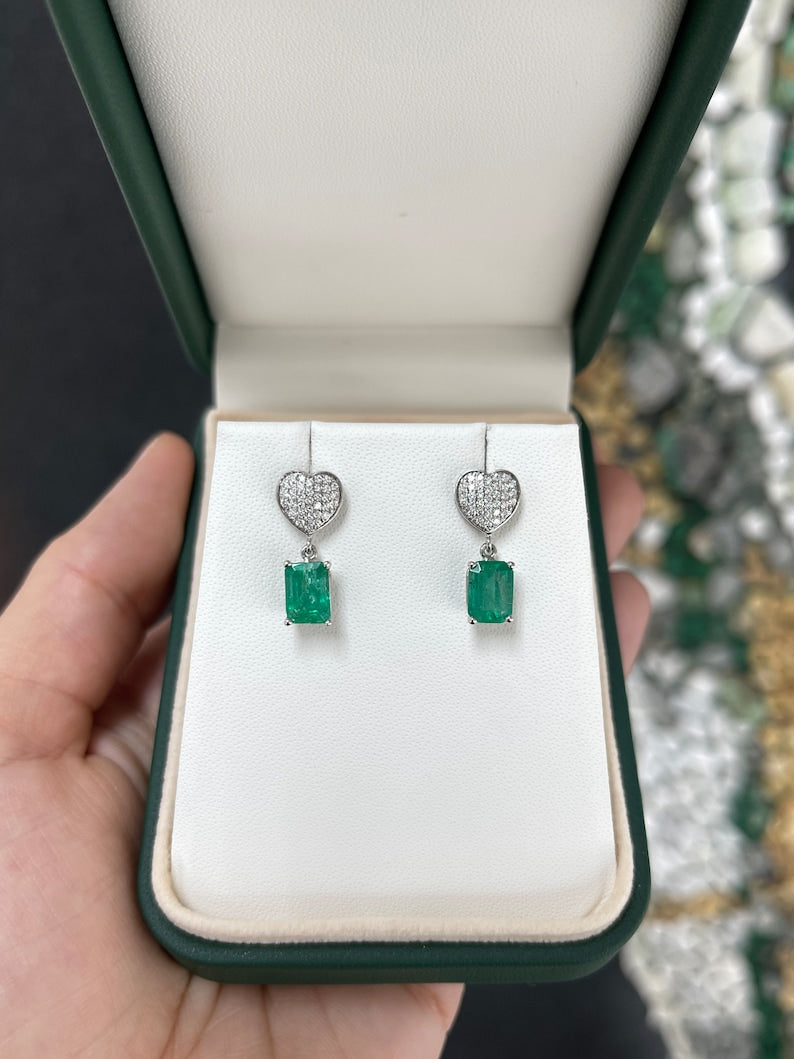 Colombian Emerald 14K gold dangle earrings with 3.20tcw medium green emeralds and diamond heart cluster design