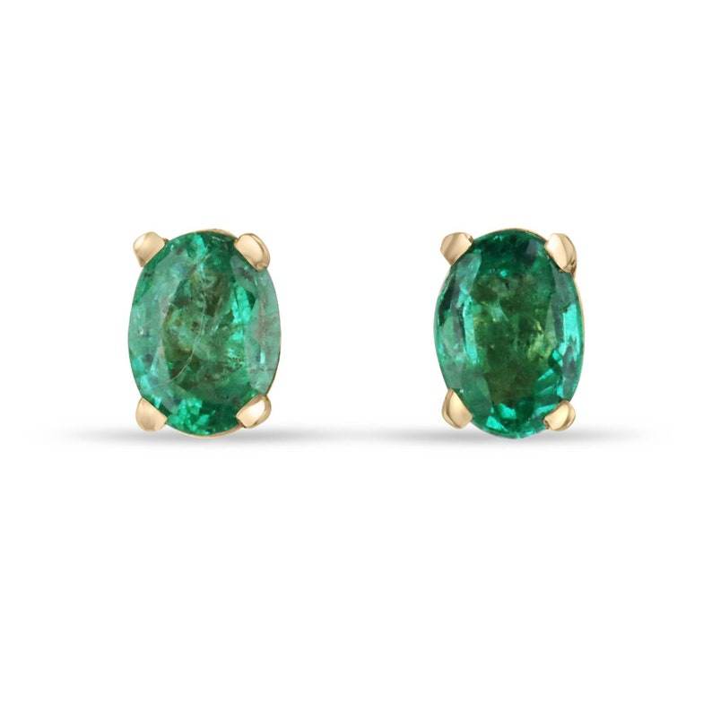 Colombian Emerald 0.80tcw 14K gold petite oval cut children’s stud earrings with four prongs and rich green color