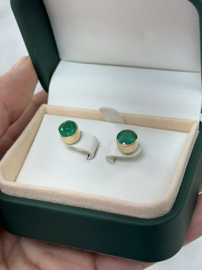 Pair of 7mm round cut emerald stud earrings in lush green, 14K gold, unisex design by Colombian Emerald.