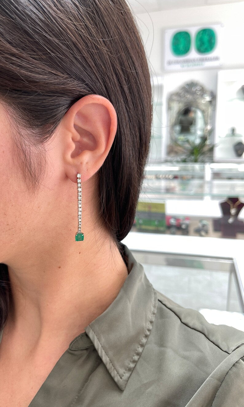 14K white gold emerald and diamond dangle earrings with dark green Asscher cut emeralds and sparkling diamonds from Colombian Emerald.