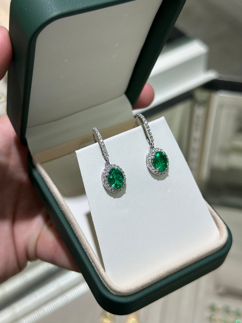 Colombian Emerald 14K white gold dangle earrings with lab-created emeralds and diamonds, showcasing elegant gemstone design.