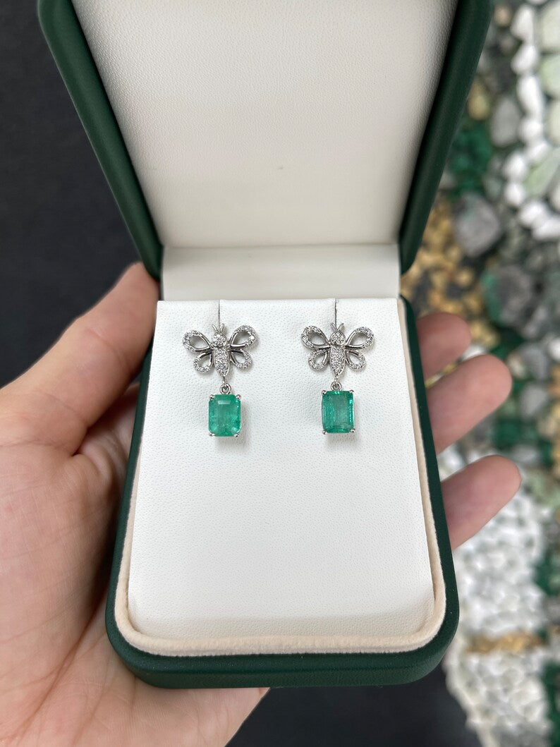 Colombian Emerald 14K gold butterfly dangle earrings with medium green emeralds and pave diamonds, jewelry accessory.