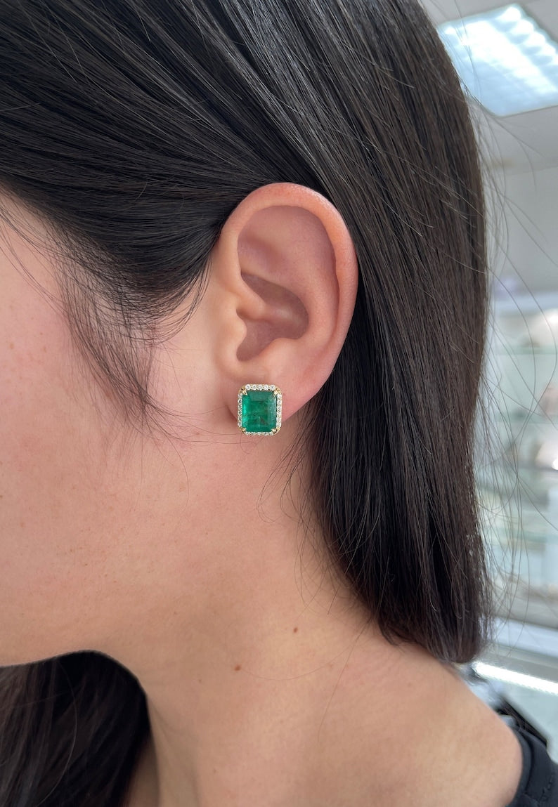 14K gold emerald and diamond halo stud earrings featuring lush dark green natural emeralds and round diamonds.