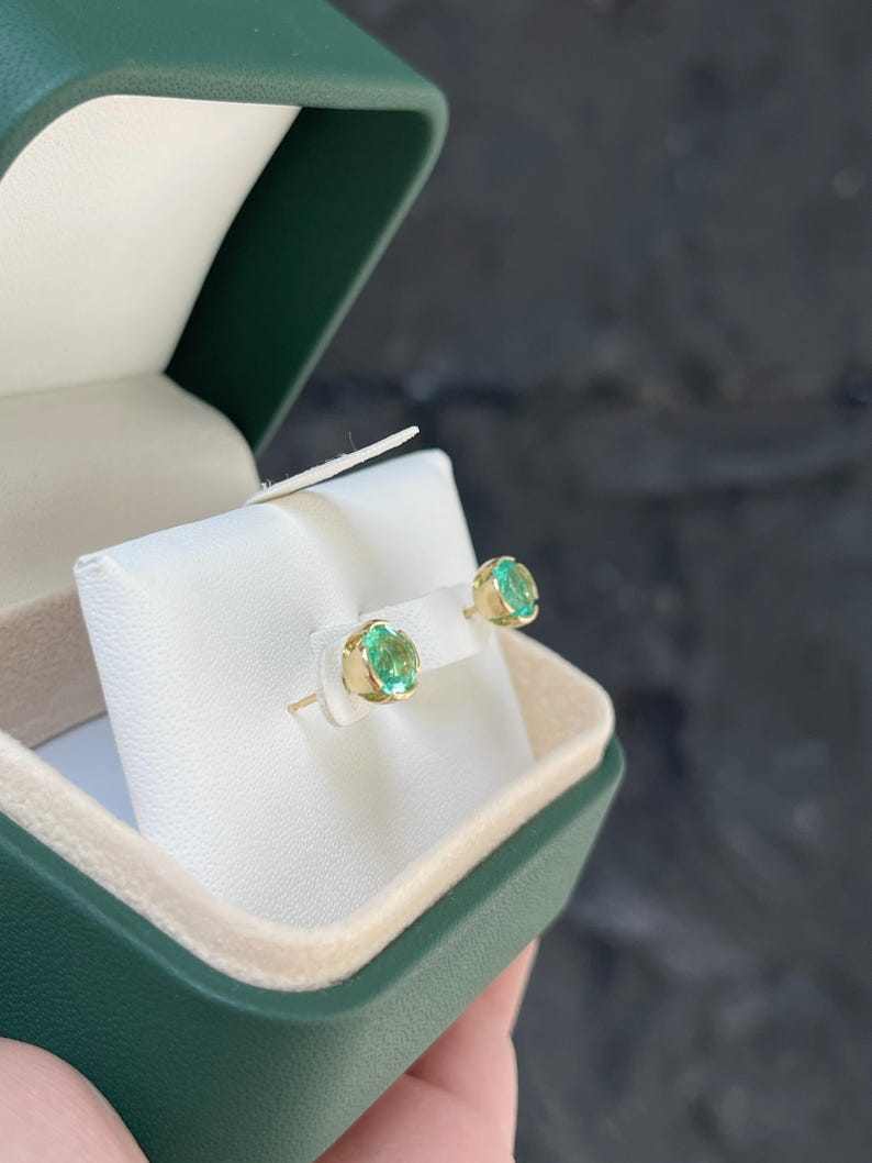 14K Colombian Emerald round stud earrings with semi bezel setting, featuring 2.0tcw vibrant green emeralds.