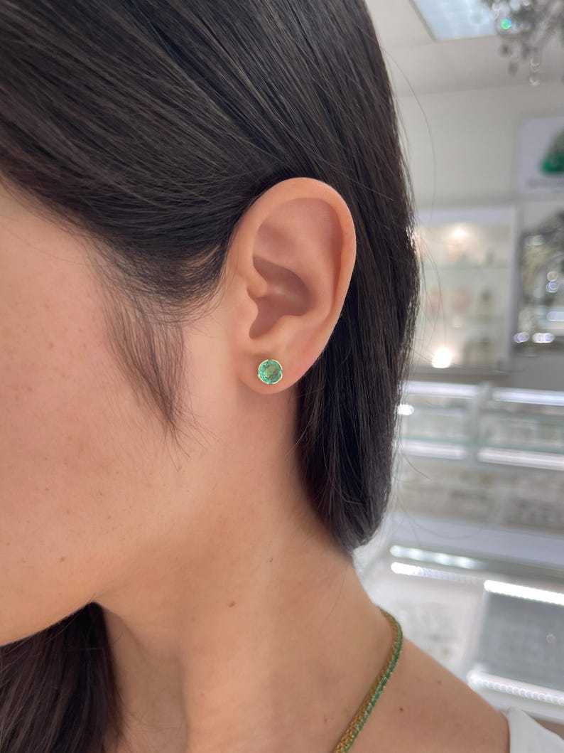 14K gold Colombian emerald round stud earrings with semi-bezel setting, 2.0 tcw, featuring vibrant green gemstones.