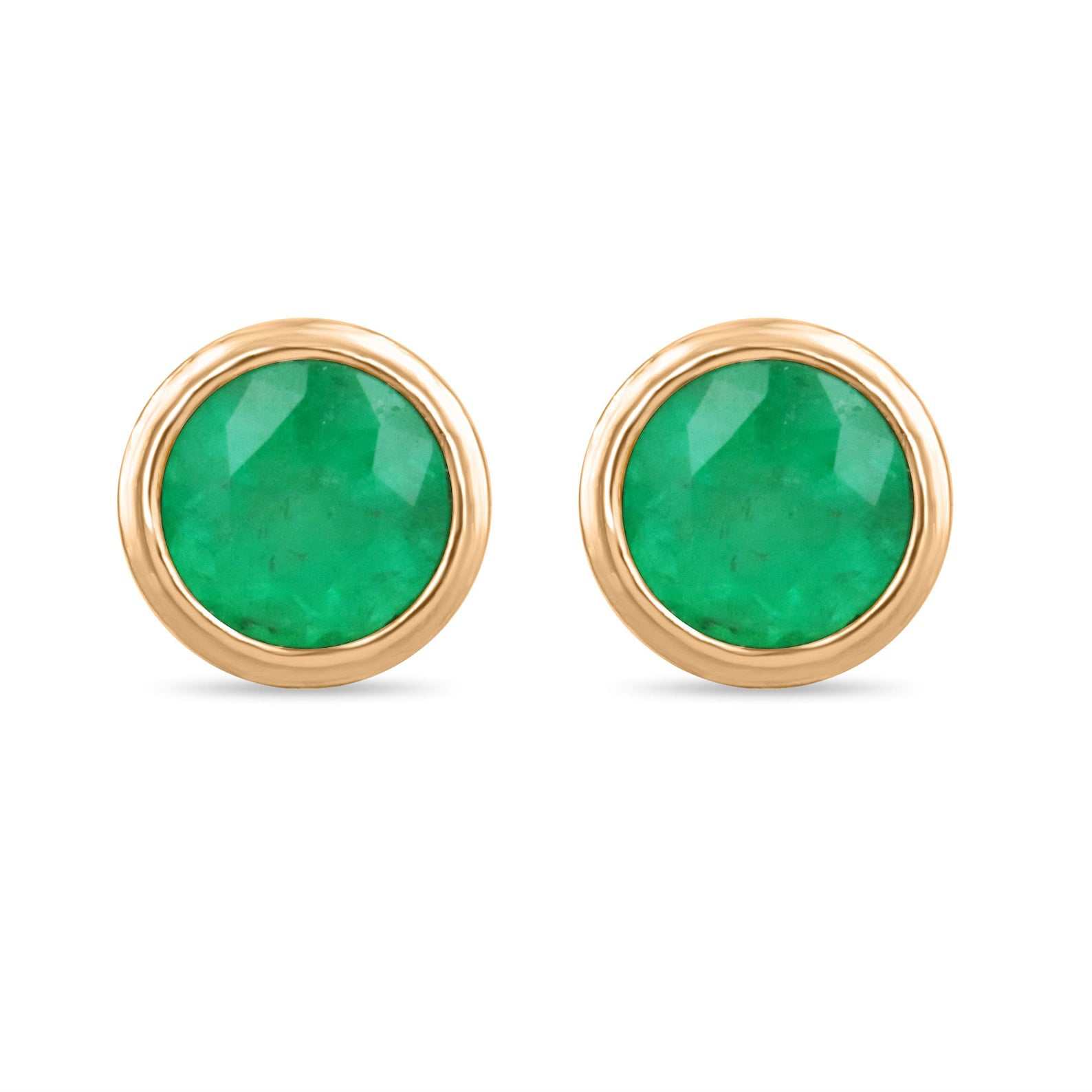 Rich green emerald stud earrings with round cut bezel setting in 14K yellow gold, featuring 1.40tcw Colombian emeralds.