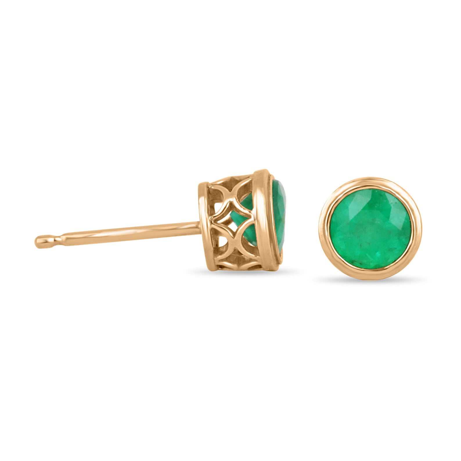 Rich green emerald stud earrings featuring round cut bezel-set Colombian emeralds in 14K yellow gold.