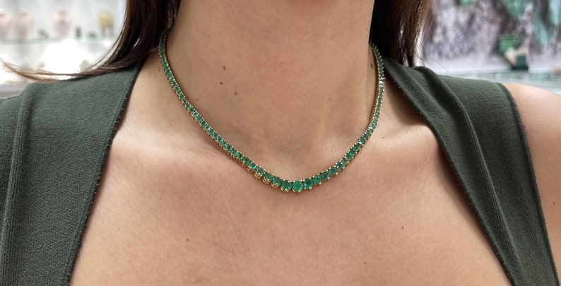 Colombian Emerald tennis necklace with 22.0 tcw of vivid medium dark green round emeralds on 14K yellow gold chain