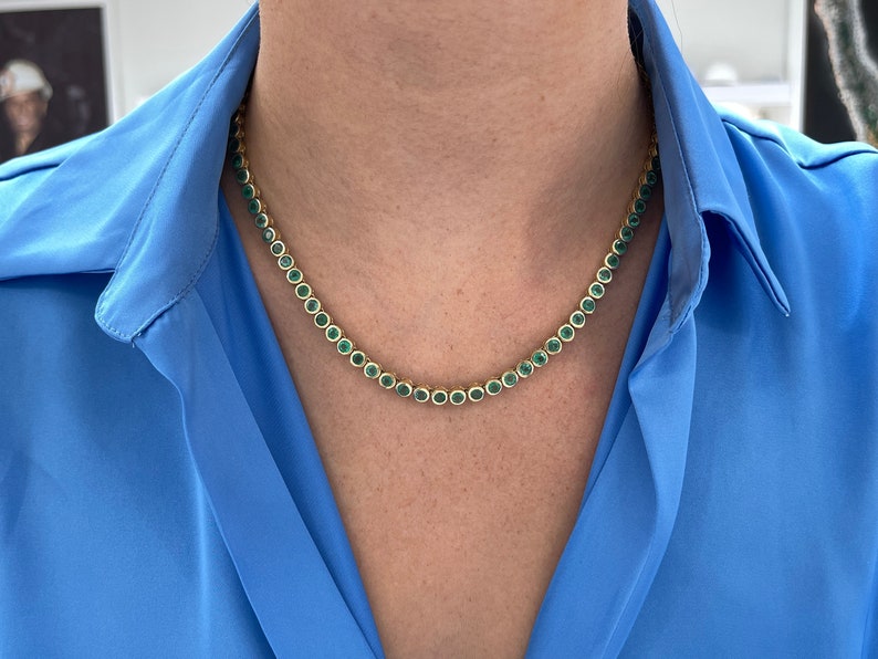 14K green emerald tennis necklace with round bezel-set stones totaling 25.50 carats, from Colombian Emerald brand.