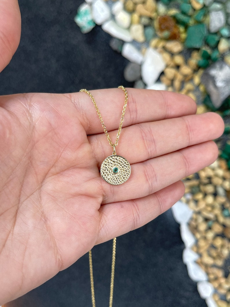 14K gold Colombian emerald pendant with a natural round 0.10ct emerald in a bezel setting, elegant solitaire medallion necklace.