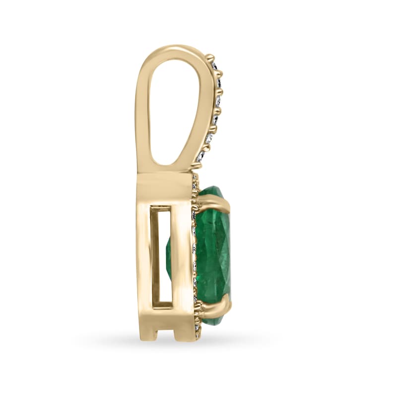 Deep green oval emerald pendant with diamond halo in 14K gold, Colombian Emerald brand, showcasing elegant jewelry design.