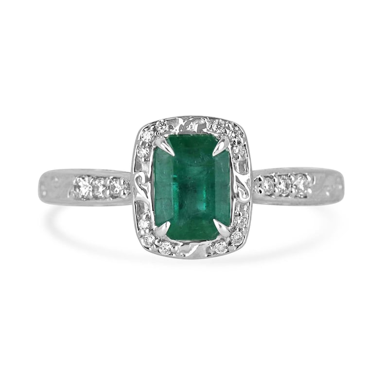 Vintage-inspired emerald cut engagement ring with floral design, diamond accents in 14K gold from Colombian Emerald.