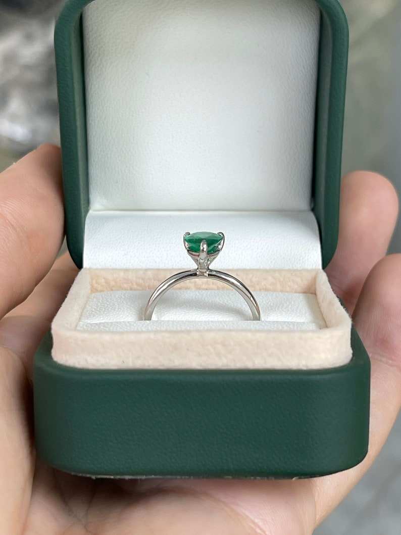 Colombian Emerald 1.28ct AAA quality pear cut engagement ring with 3 prongs in 18K white gold.
