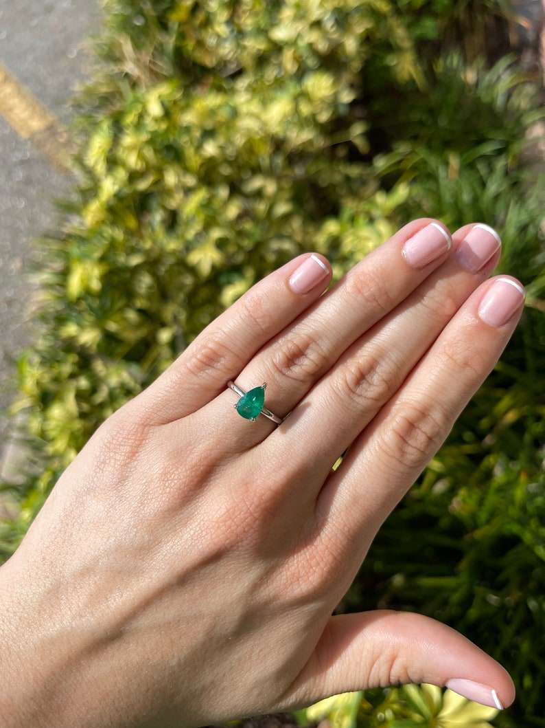 Pear-shaped 1.28ct AAA quality Colombian emerald engagement ring with 3 prongs in 18K white gold.