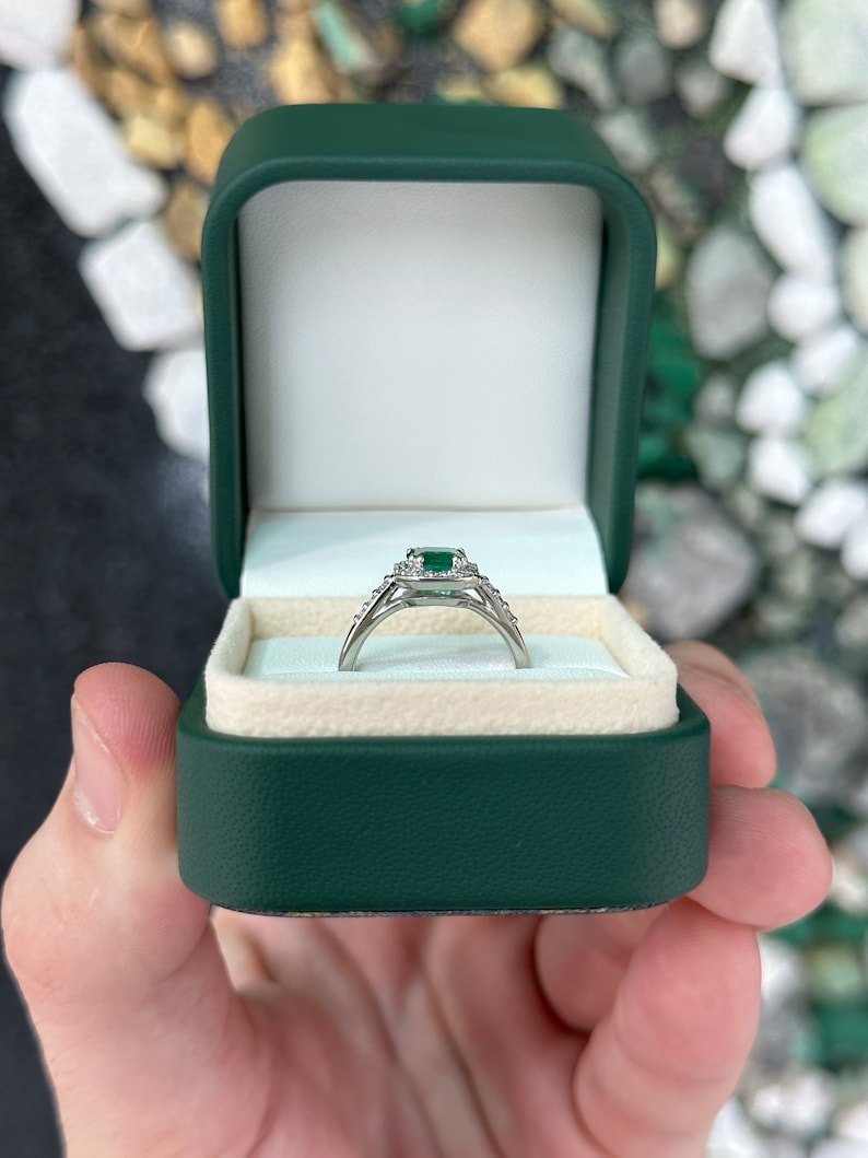 High-quality Zambian emerald cut emerald and diamond halo engagement ring in 14K gold by Colombian Emerald.