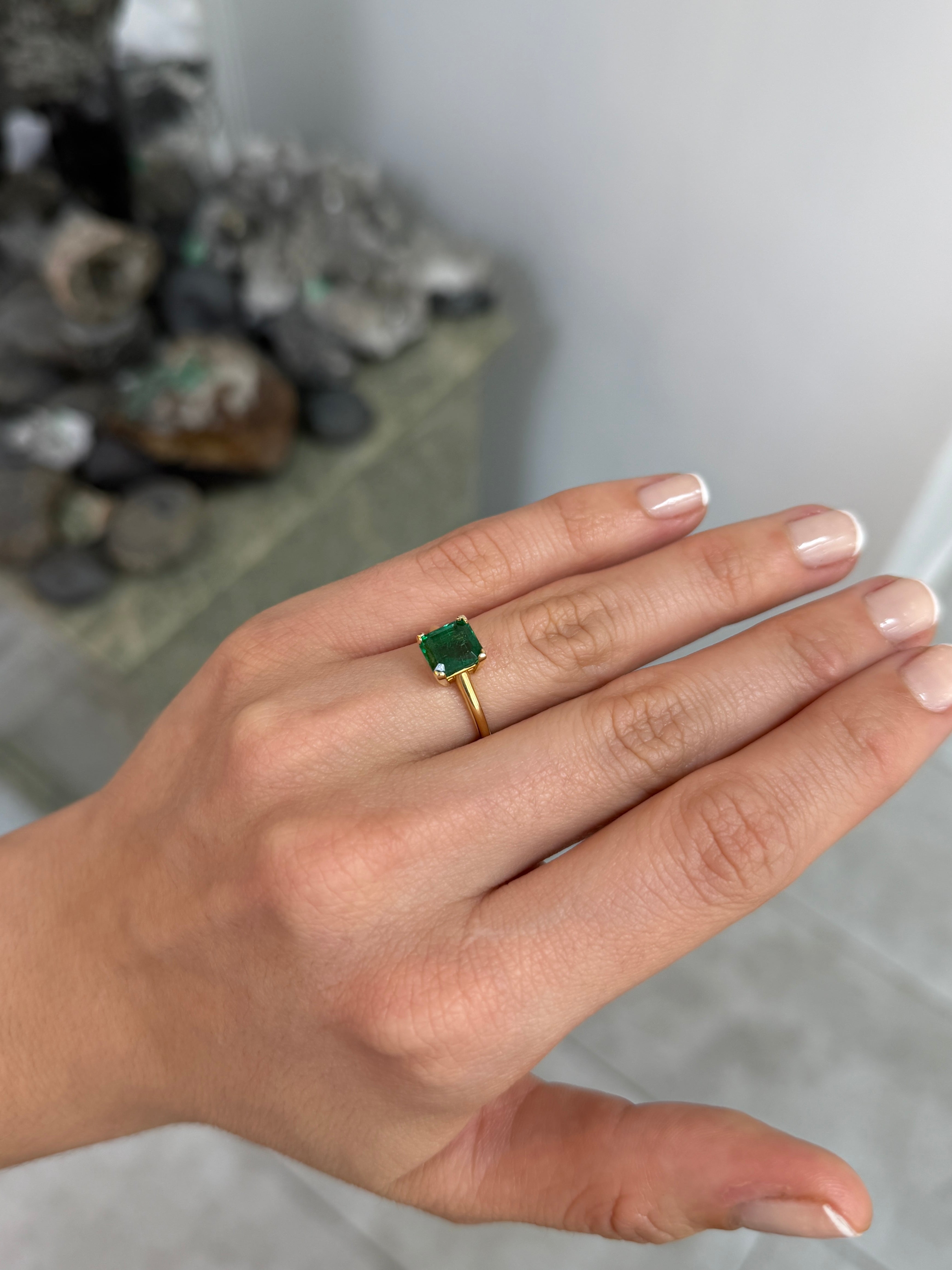 Deep green 1.99ct Asscher cut emerald solitaire engagement ring with V prong setting in 14K gold by Colombian Emerald.