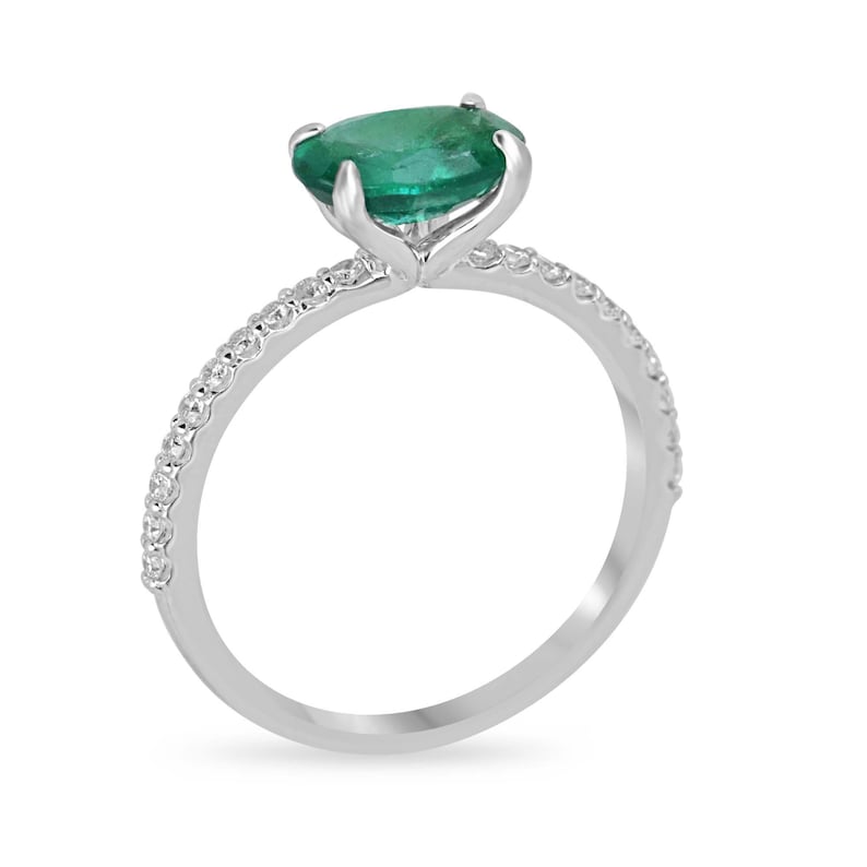14K gold engagement ring featuring 1.60tcw East to West Zambian emerald and diamond accents. Colombian Emerald brand.