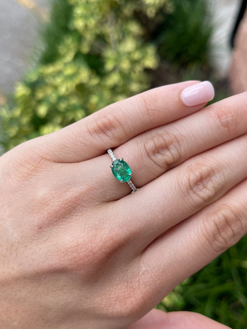 14K white gold engagement ring featuring 1.60tcw east-to-west Zambian emerald with diamond accents from Colombian Emerald brand.