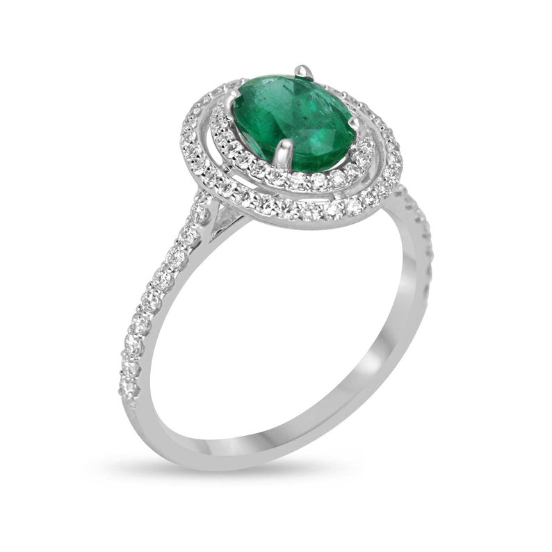 Colombian Emerald 8x6 oval cut green engagement ring with double diamond halo in 14K gold, showcasing a lush rich green emerald.