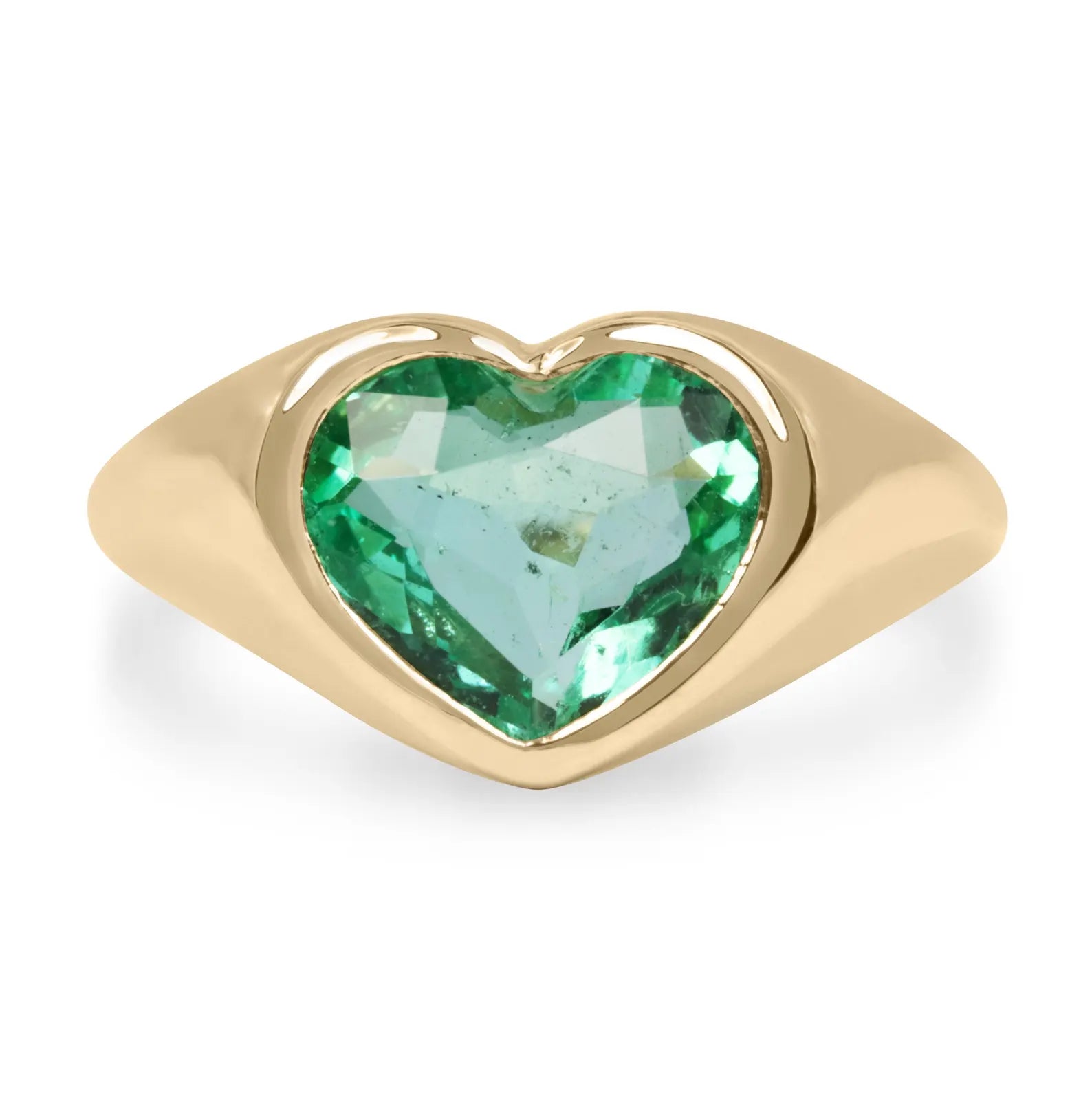 Unisex engagement ring featuring a heart-cut Colombian emerald bezel-set in 18K gold, available through private link.