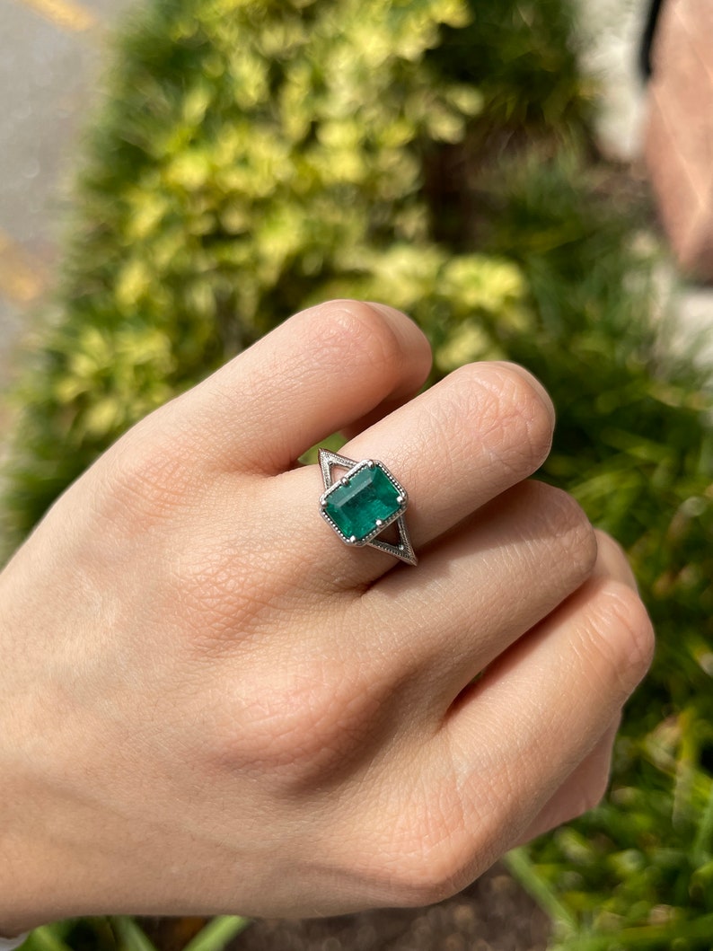 Stylish Platinum Ring with a 2.22ct Emerald Cut Bluish Green Stone