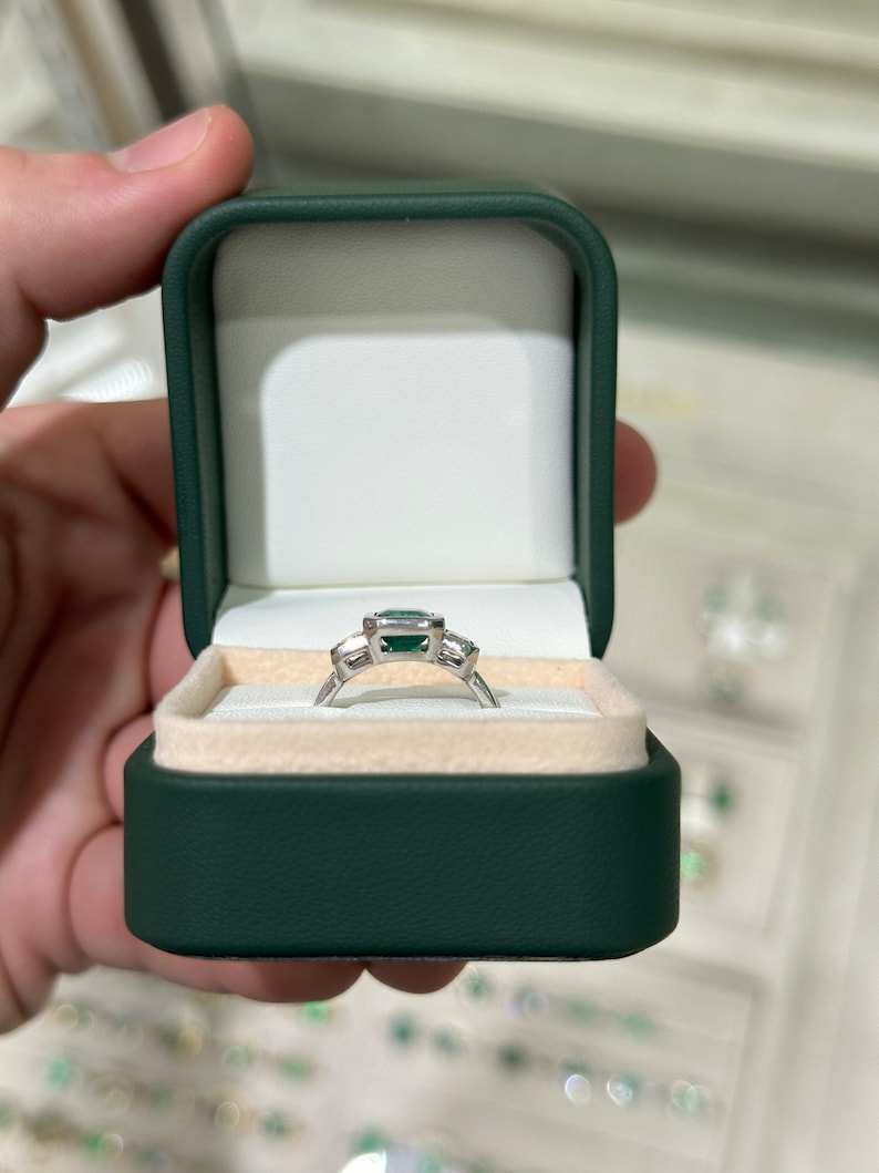 14K gold engagement ring with 2.25 carat GIA-certified natural emerald cut diamonds, three-stone design by Colombian Emerald