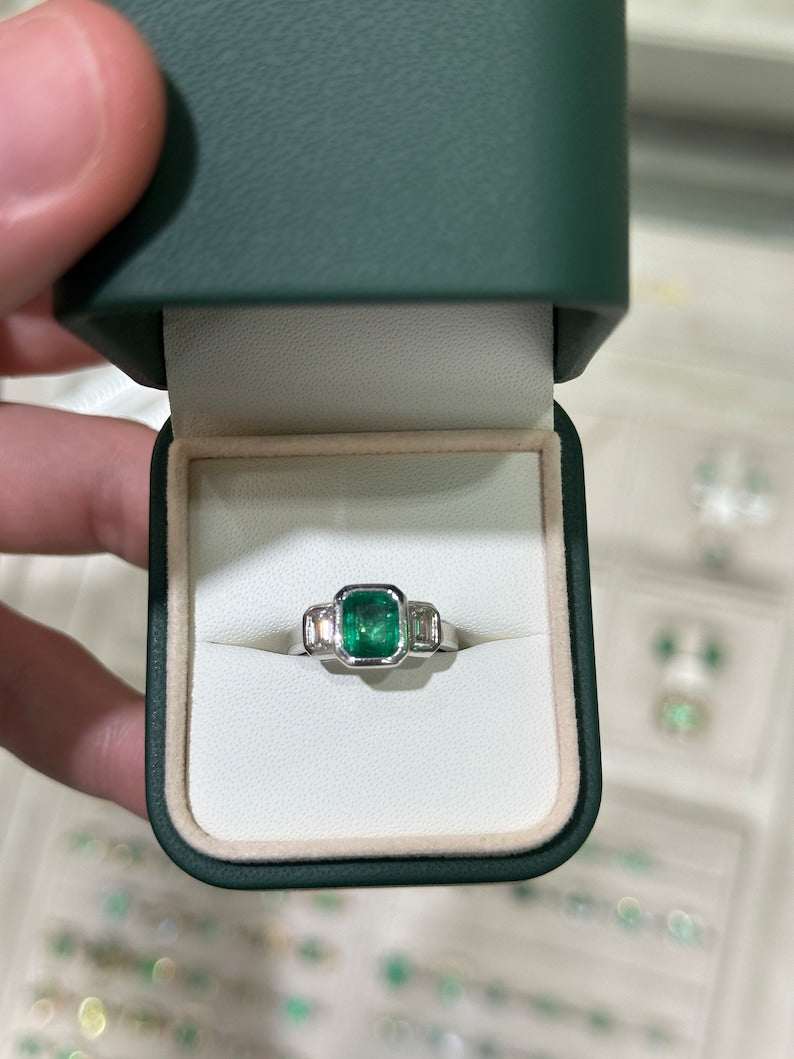 14K gold engagement ring with three emerald cut diamonds totaling 2.25 carats, featuring a natural GIA-certified Colombian emerald.